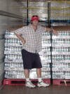 Robert Evans of Nine.com stands near pallets of water being unloaded in Houston.